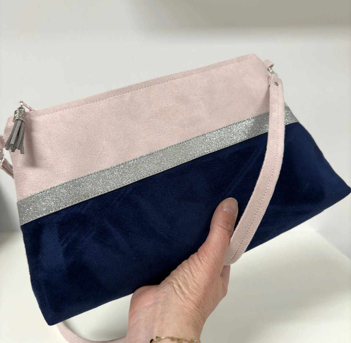 Pale pink and navy blue Isa shoulder bag with silver sequins
