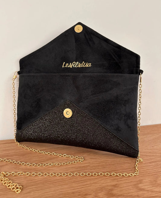 Le sac pochette Isa noir et doré à paillettes, ouvert.