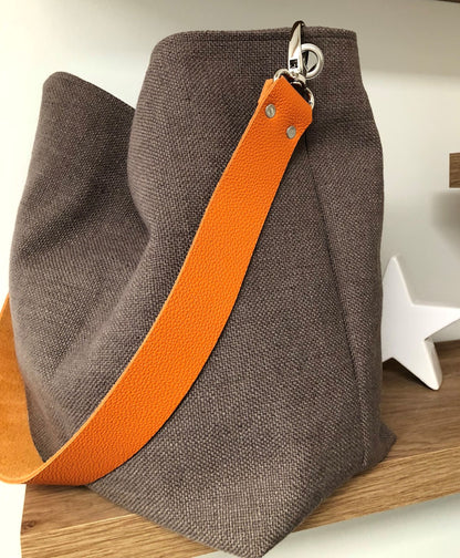 Hobo bag in earth brown linen, orange leather handle