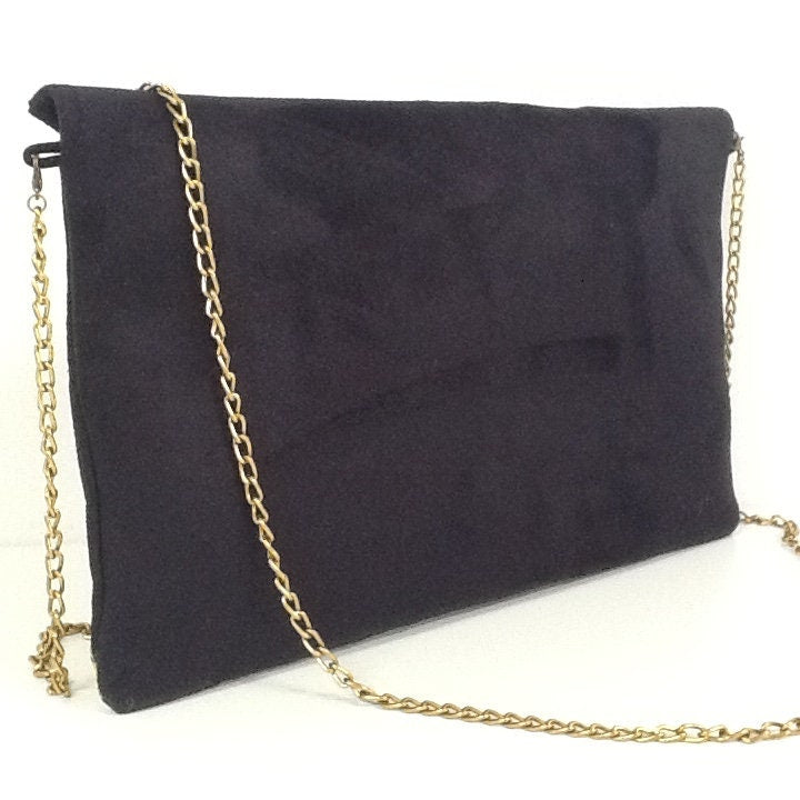 Isa clutch bag black and leopard with gold sequins