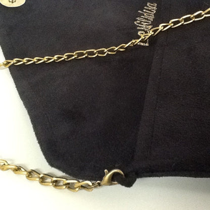 Isa clutch bag black and leopard with gold sequins