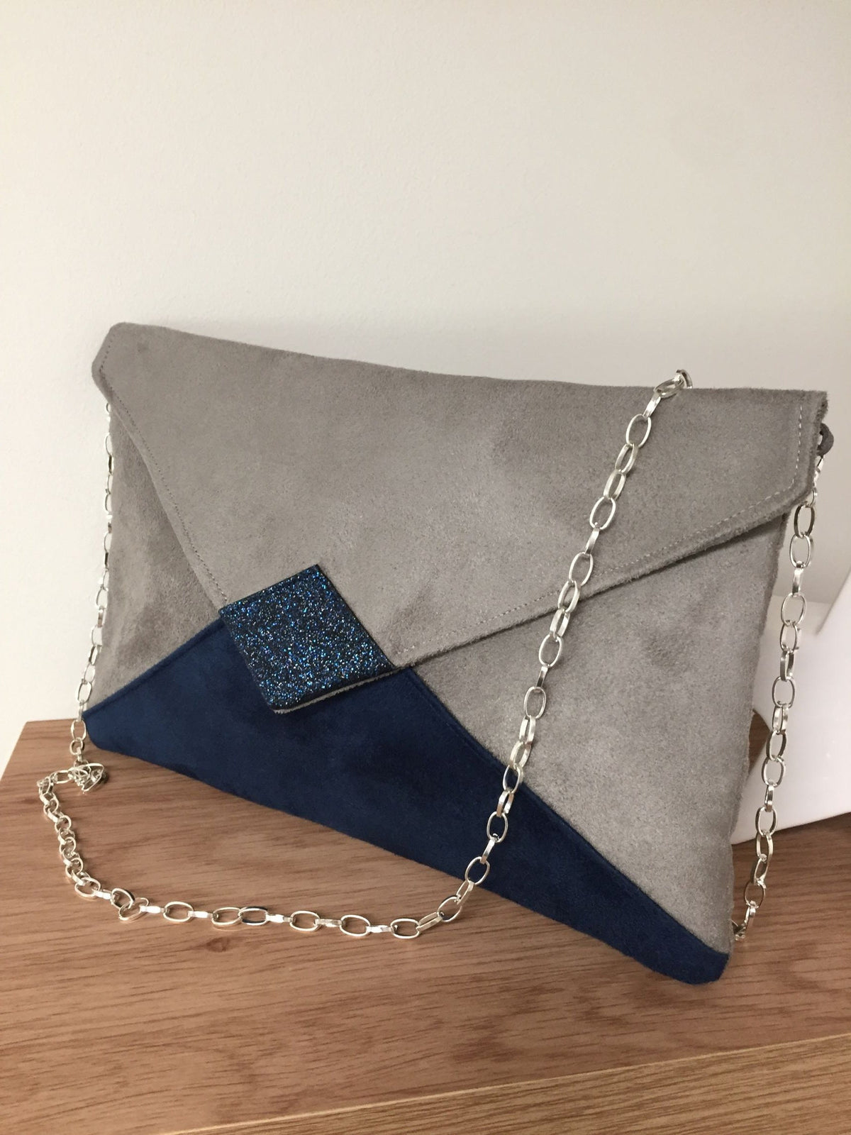 Isa clutch bag in taupe gray and navy blue with sequins