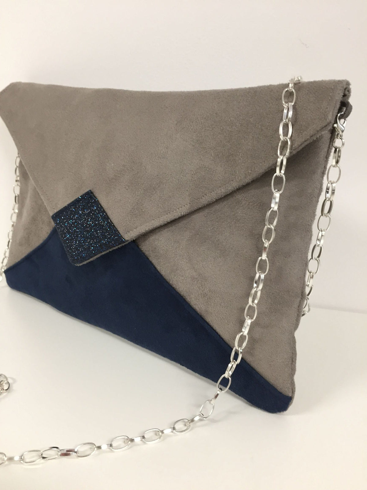 Isa clutch bag in taupe gray and navy blue with sequins
