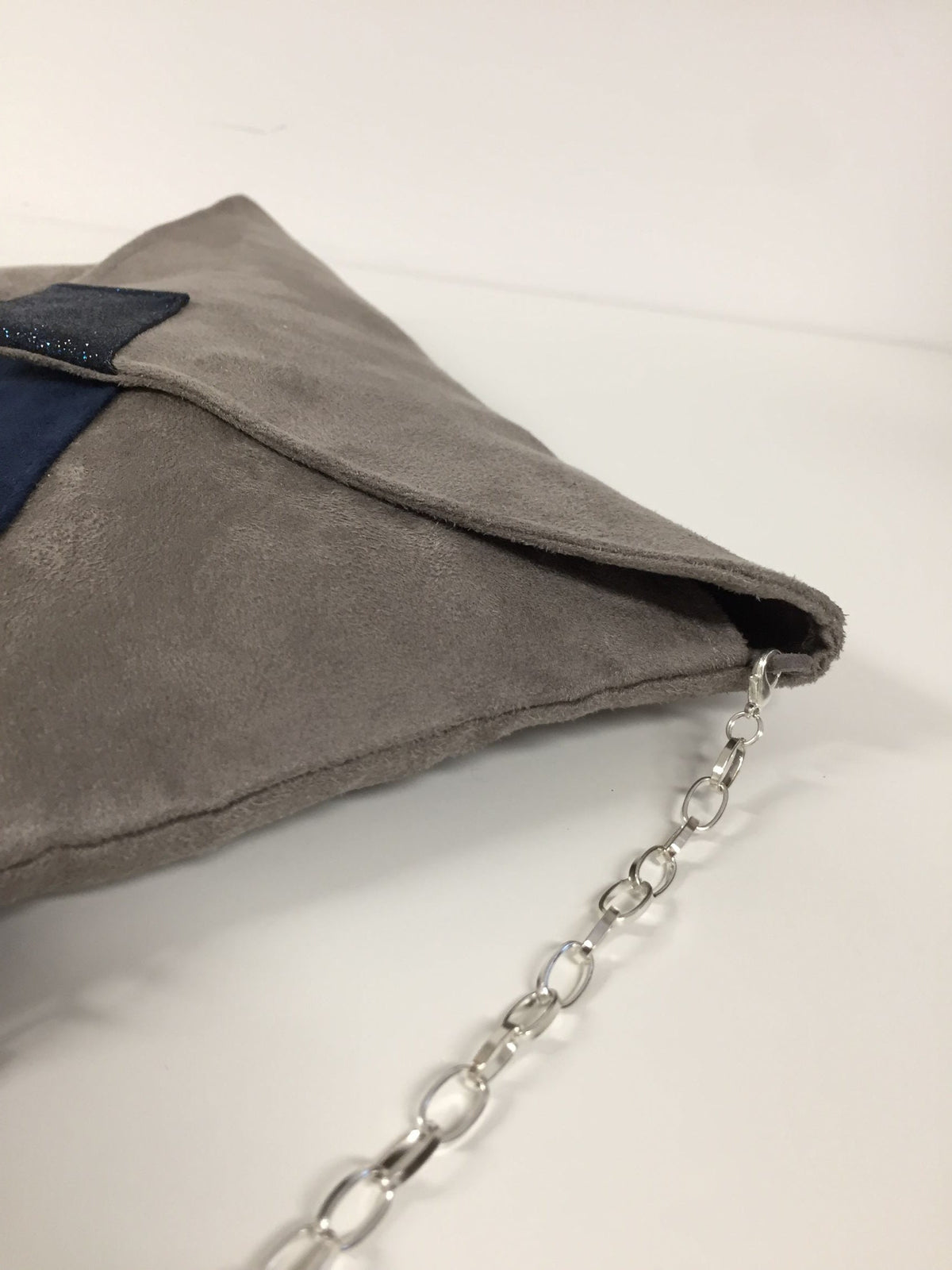 Isa clutch bag in taupe gray and navy blue with sequins
